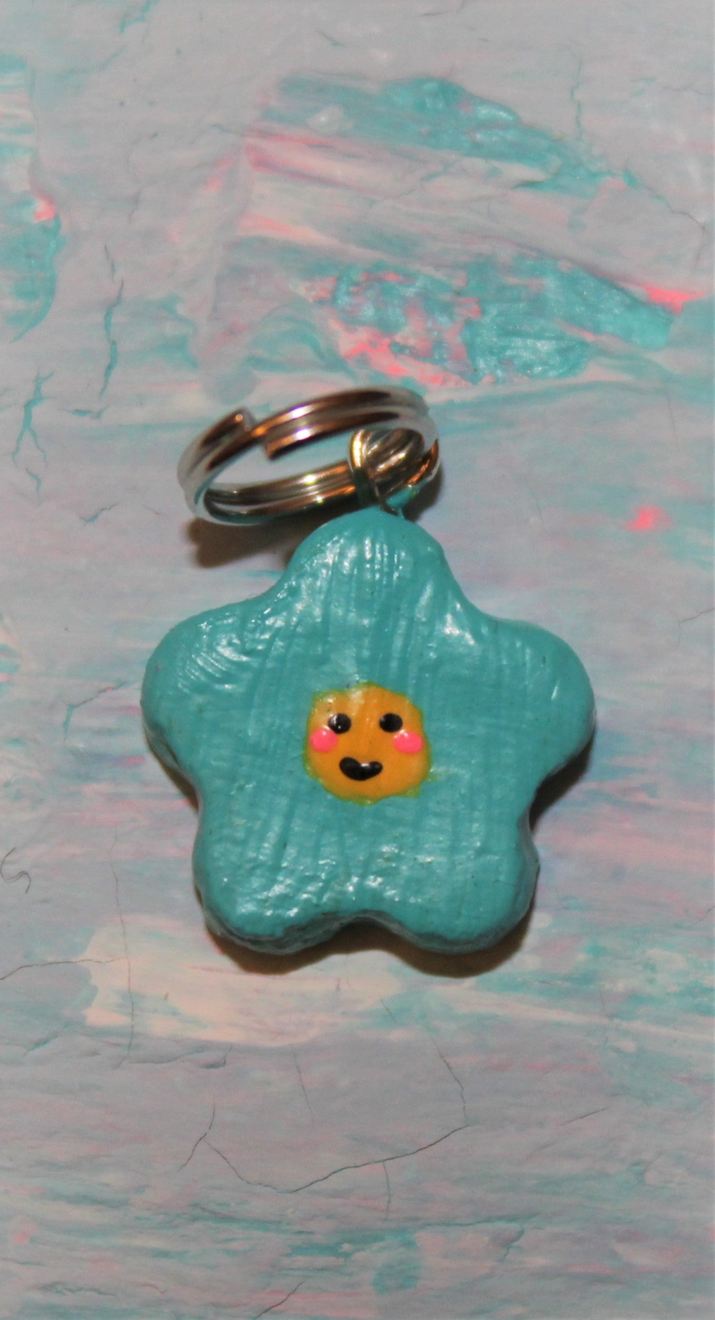 Cyan Smiley Face Flower Charm